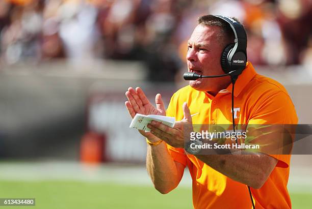 Head coach of the Tennessee Volunteers Butch Jones watches a play in the first half of their game against the Texas A&M Aggies at Kyle Field on...