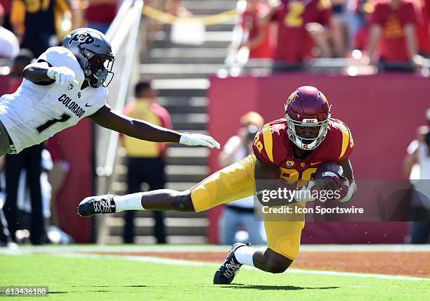 Daniel Imatorbhebhe catches a pass for a touchdown against Colorado Afolabi Laguda during an NCAA football game between the Colorado Buffaloes and...