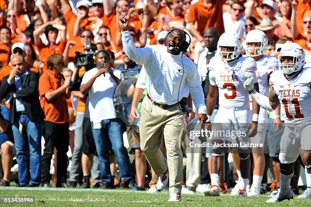 Head coach Charlie Strong of the Texas Longhorns reacts to a Sooners fumble during their loss to the Oklahoma Sooners on October 8, 2016 at The...