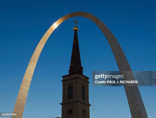 The Gateway Arch is seen over the Old Cathdral the Basilica in Saint Louis, Missouri on October 8, 2016. US Presidential Republican nominee Donald...