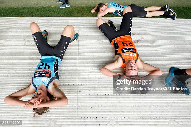 Kobe Mutch and Joshua Begley recover after the 3km time trail during the AFL Draft Combine on October 9, 2016 in Melbourne, Australia.