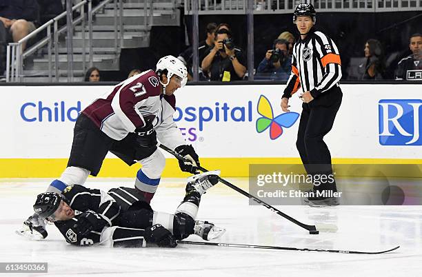 Brayden McNabb of the Los Angeles Kings tries to block a shot by Andreas Martinsen of the Colorado Avalanche during their preseason game at T-Mobile...