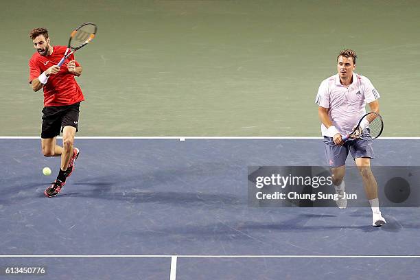 Marcel Granollers of Spain and Marcin Matkowski of Poland in action during the men's doubles final match against Raven Klaasen of South Africa and...