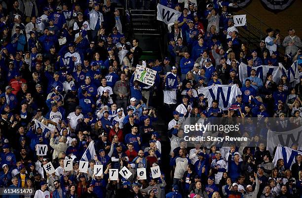 Fans celebrate after the Chicago Cubs beat the San Francisco Giants 5-2 at Wrigley Field on October 8, 2016 in Chicago, Illinois.