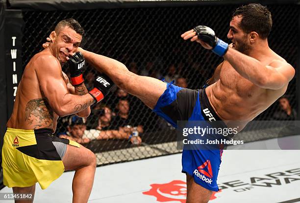 Gegard Mousasi of The Netherlands kicks Vitor Belfort of Brazil in their middleweight bout during the UFC 204 Fight Night at the Manchester Evening...