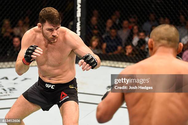 Michael Bisping of England circles Dan Henderson in their UFC middleweight championship bout during the UFC 204 Fight Night at the Manchester Evening...