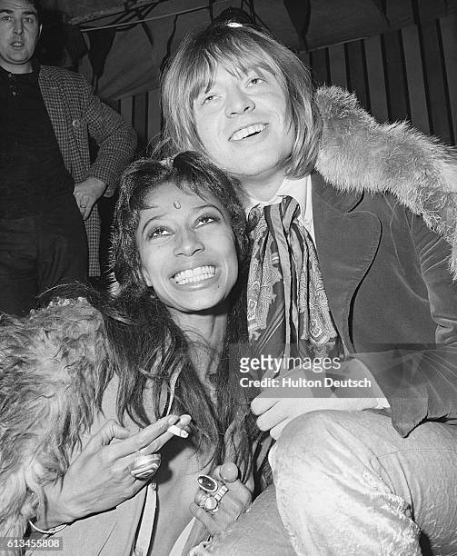Model Donyale Luna and Brian Jones of The Rolling Stones at the recording of the television show Rolling Stones Rock'n'Roll Circus Show.