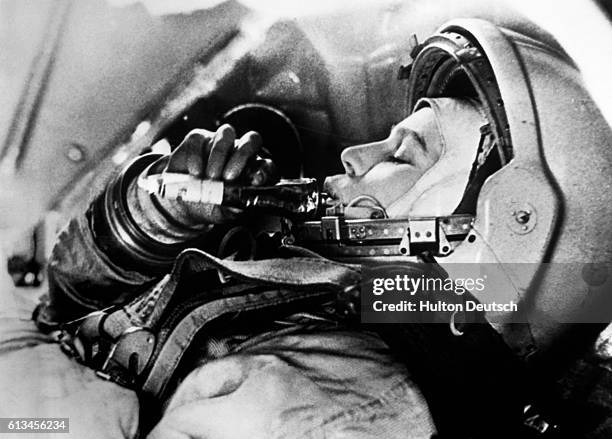 Valentina Vladimirovna Tereshkova practices eating in flight simulations for launch into space. On June 16 Tereshkova, at age 26, was launched into...