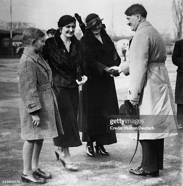 Adolf Hitler greets his sister at Templehofer airfield.