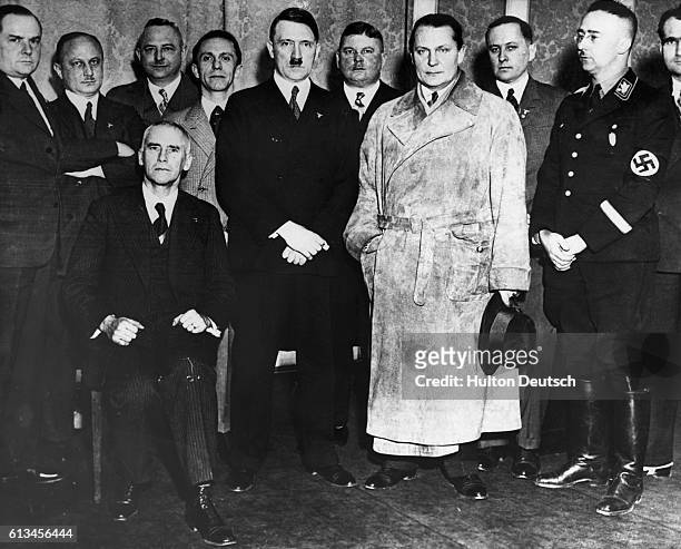 Hitler, newly appointed German Chancellor, stands with senior members of the Nazi party,