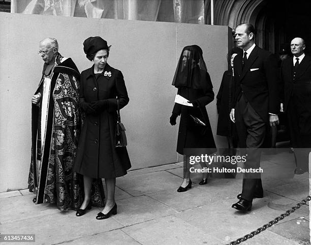 Queen Elizabeth II of England leaves Saint George's Chapel, Windsor, after the funeral service of Edward, Duke of Windsor, before his burial at...