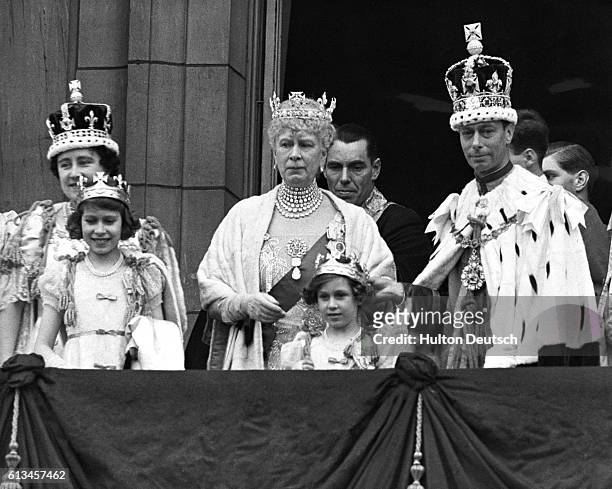 The British royal family greet their subjects from the balcony of Buckingham Palace on the day of George VI's coronation. From left to right: Queen...