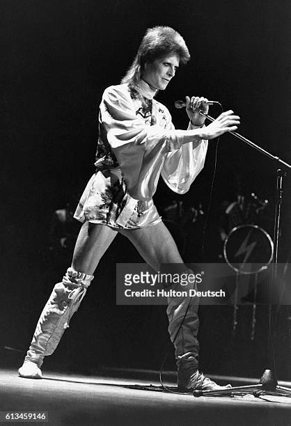 David Bowie in concert at the Hammersmith Odeon in London on the last night of his Ziggy Stardust UK tour.