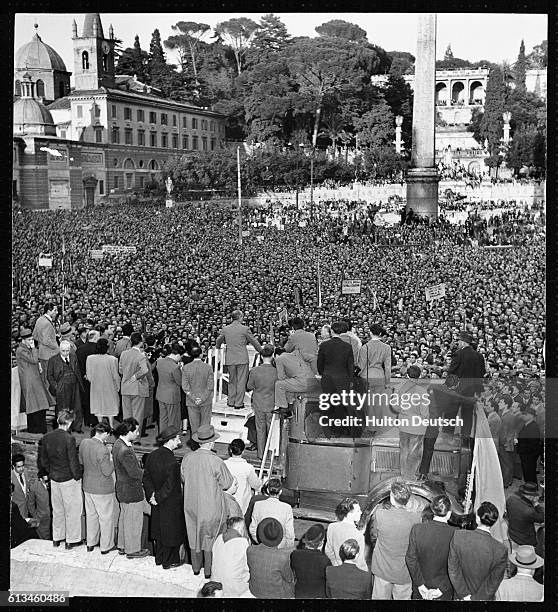 Palmiro Togliatti the leader of the Italian Communist Party addresses a large crowd gathered in Rome to hear him speak.