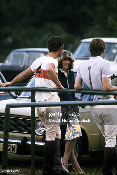 Prince Charles chats to Camilla Parker-Bowles at a polo match, circa 1972.