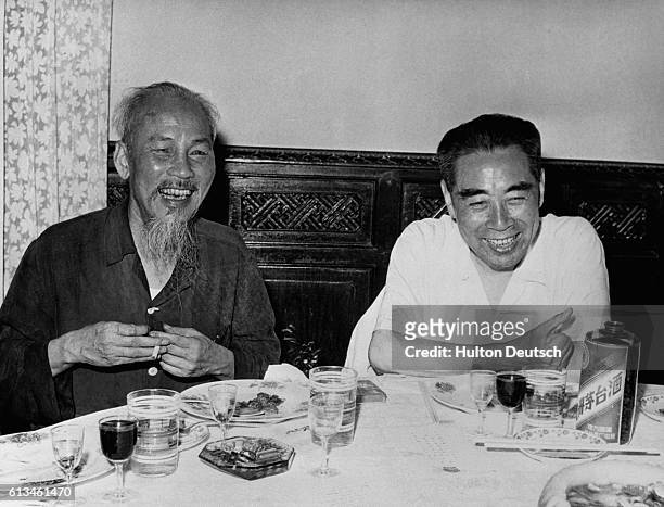 Ho Chi Minh , the Communist president of the People's Republic of Vietnam, in jovial mood while dining with the Chinese premier, Chou En-lai, during...