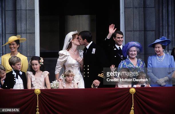 Andrew and Sarah, the Duke and Duchess of York kiss on the balcony of Buckingham Palace after their wedding at Westminster Abbey. Also shown are...