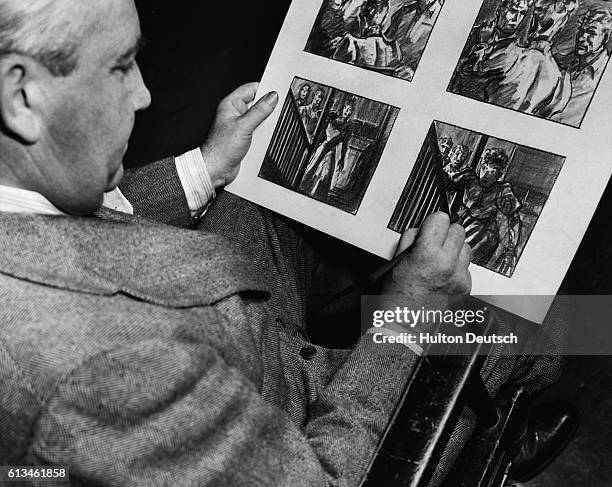 Artist Menzies goes over his rough draft of a storyboard for a movie starring Ann Sheridan and Ronald Reagan.