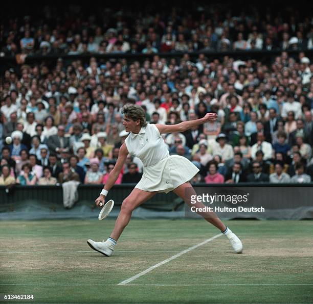Tennis player Margaret Court Smith swings at a ball during the 1965 Wimbledon Championship.