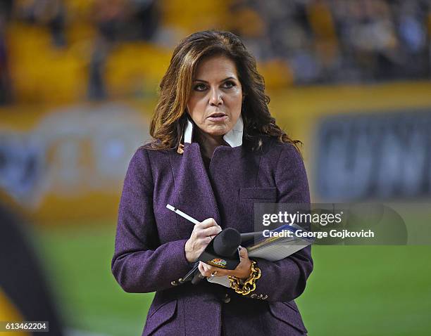 Michele Tafoya, NBC Sports Sunday Night Football sideline reporter, looks on from the sideline before a game between the Kansas City Chiefs and...