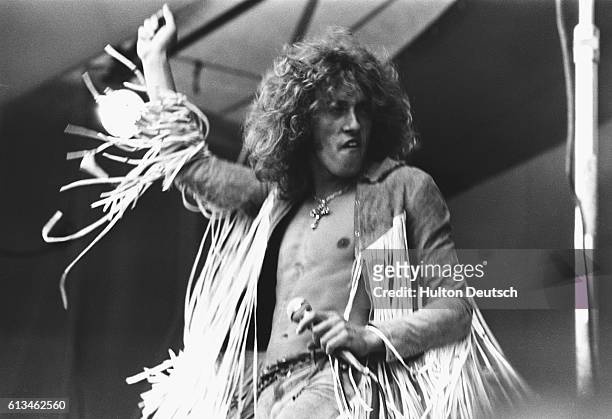 Roger Daltrey, lead singer of The Who, performing on stage at the Isle of Wight Festival in August 1969. The group also appeared with Bob Dylan on...