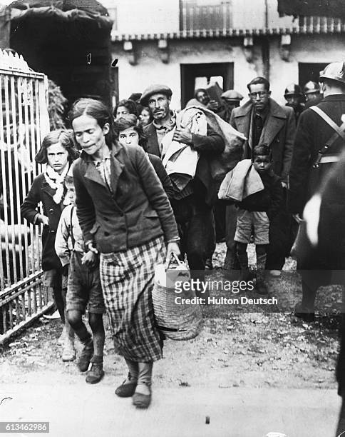Refugees forced from their homes as a result of the Spanish Civil War arrive at the French border town of Luchon.