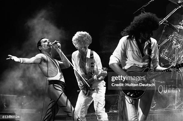 The rock band Queen in concert in 1984. Lead singer Freddie Mercury, John Deacon and Brian May.