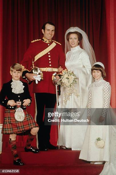 Princess Anne on her wedding day with her husband Mark Phillips, her younger brother Prince Edward, and cousin Lady Sarah Armstrong-Jones.