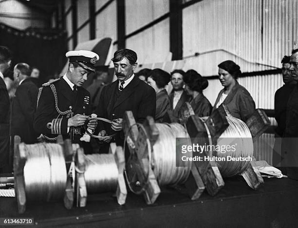 Edward, Prince Of Wales, talks to the foreman during a visit to the supermarine aviation works in Southampton.