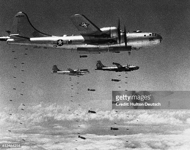 America Defends Her Freedom - An Armed Forces Day Historical Feature. US Air Force Superfortresses drop their bomb loads on a strategic target during...