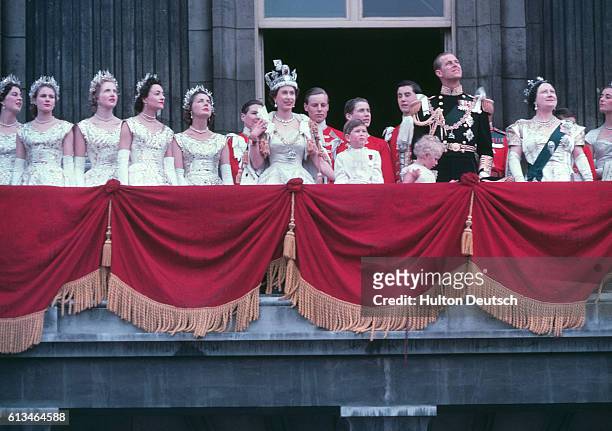 The Royal Family on the balcony of Buckingham Palace after the Coronation of Queen Elizabeth II, June 1953. The Queen is center, waving. From left to...