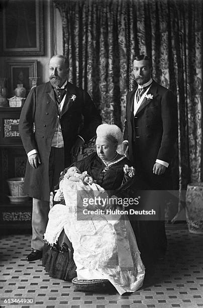 Queen Victoria of England with her son Albert Edward, Prince of Wales (the future King Edward VII of England; his son Prince George ; and his son...