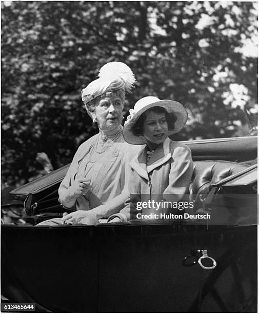 Princess Elizabeth with her Grandmother Queen Mary in an open carriage.