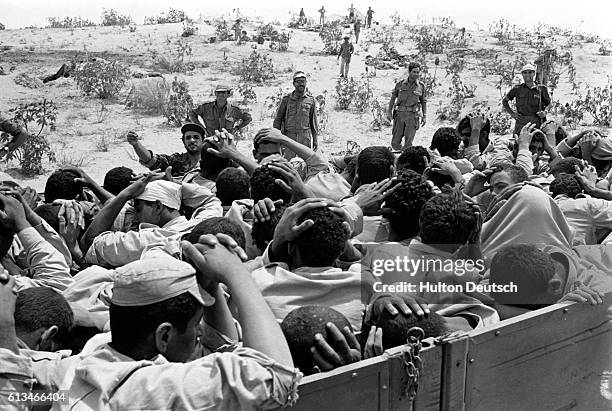 Egyptian prisoners put their hands on their heads. They were captured in an Israeli advance during the Six-Day War.