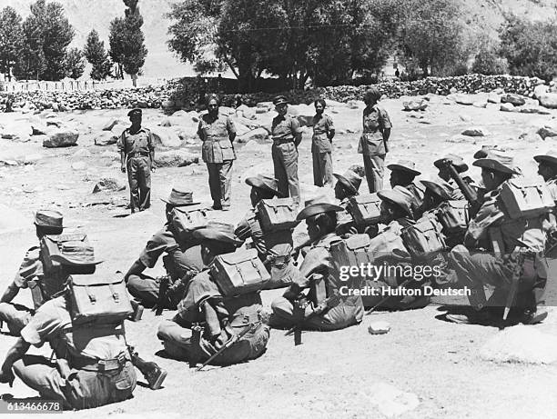 Indian troops being inspected before leaving their posts in the Ladakh border region during the war between India and China, 1962-63.