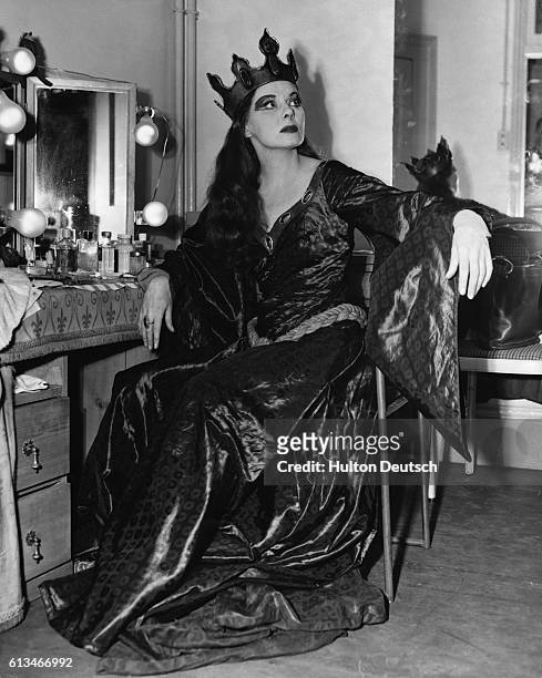 English actress Ann Todd in her dressing room at the Old Vic, London, 1954. Miss Todd is dressed for her role as Lady Macbeth.