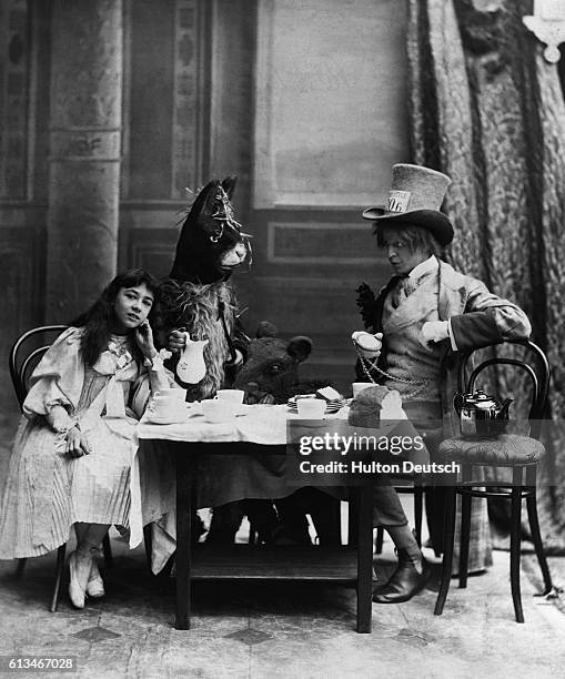 The Mad Hatter, the March Hare and Alice at the Mad Hatter's tea party from Alice in Wonderland by Lewis Carroll.