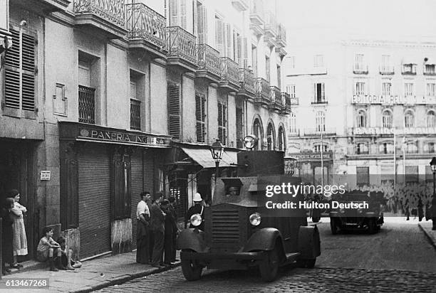 View of storm guards arriving in armored vehicles on the Calle del Cerreo in Madrid, temporary home of the Ministry of Government during the Spanish...