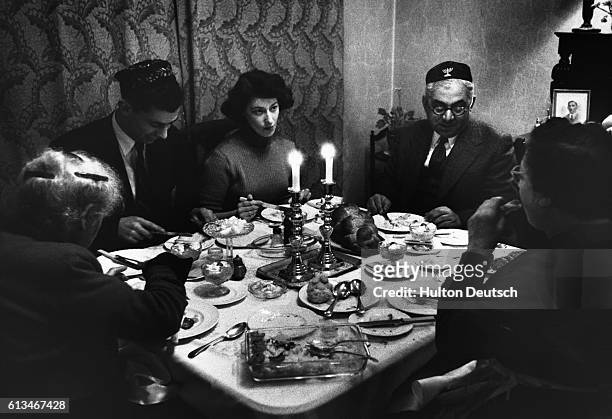 Louis Saipe, historian of Leeds jewry, and his wife entertain their son and daughter-in-law to a candle-lit meal on the eve of Sabbath.