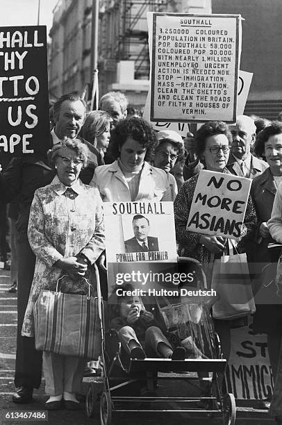 Anti-immigrationists and Enoch Powell supporters march in portest at rising unemployment and the immigration of Ugandan Asians.