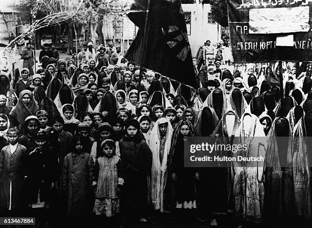 Kurdish women at a meeting to demand equal rights. Some women no longer wear the traditional face veil as a sign of protest.