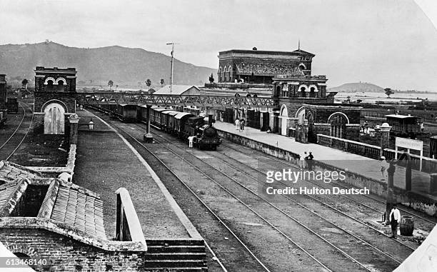Locomotive pulls into a railway station near Calcutta in 1867.