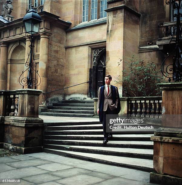 Prince Charles walking in his gown during his time as an undergraduate at Trinity College, Cambridge. | Location: Cambridge, Cambridgeshire, England,...