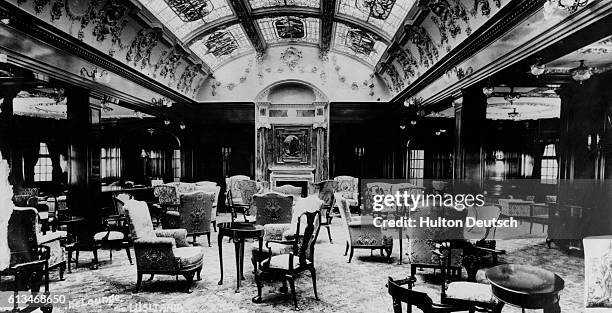 An array of chairs and tables span the lavish carpeting of the lounge. Complete with a skylight and fireplace, this would be the perfect place for...