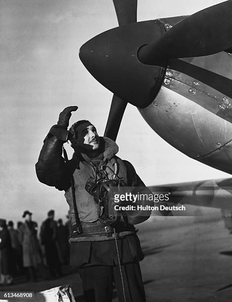 Royal Air Force pilot prepares to climb into his Spitfire on a British airbase to take part in the Battle of Britain in 1940 during World War II.