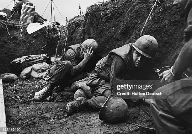 Soldier take cover during fighting in Vietnam.