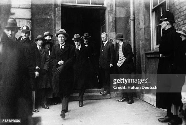 Michael Collins, arrives at Dublin Castle, with Sinn Fein staff members, to consolidate the government of Ireland in January 1922. Collins became the...