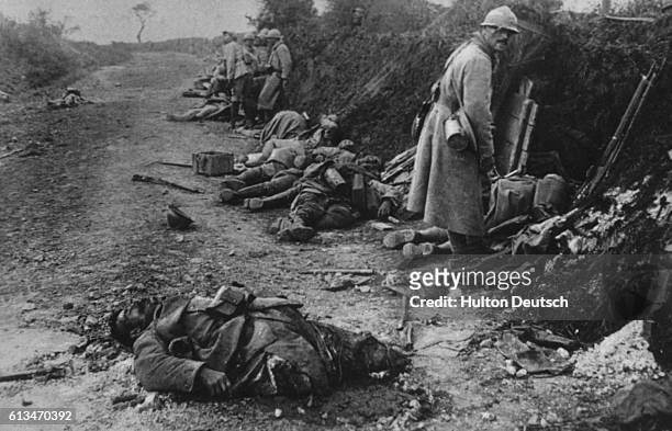 Soldiers among dead and maimed corpses during World War I.
