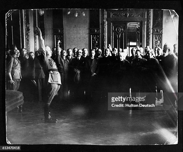 Group of Spanish fascists saluting General Franco's self-appointment as dictator or Caudillo of Spain during the Spanish Civil War.