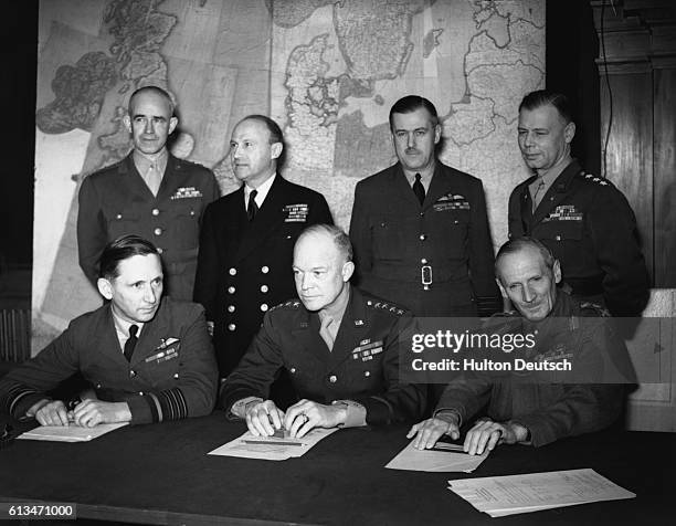 General Dwight D. Eisenhower , the supreme commander of Allied forces, with his fellow US and British officers in command.